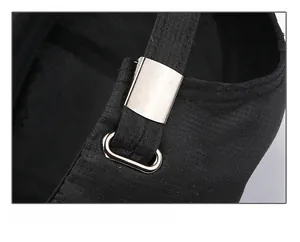 Detail of adjustable metal buckle and black fabric strap on the back of baseball cap