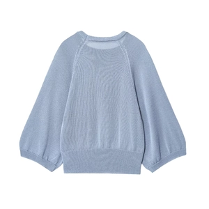 Minimalist light blue loose knit sweater with raglan sleeves and ribbed cuffs on white back