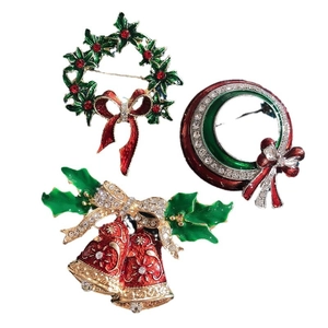 Christmas brooch set with holly wreath and bell designs in enamel and rhinestones