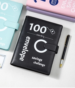 Detail of A5 100-day savings challenge binder with black PU leather cover and pen