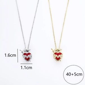 Red heart crystal pendant necklace with arrow and gold pattern in silver and gold finish