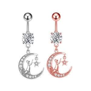 Detailed view of cat and moon zircon navel rings in silver and rose gold finishes
