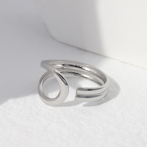 Polished silver stainless steel open ring with a modern geometric twisted design