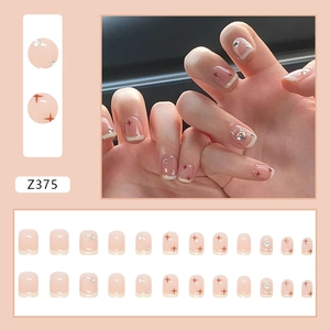 Détails de 24 faux ongles rose nude avec motifs d'étoiles et strass en forme de cœur