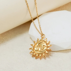 Retro 18K gold titanium steel necklace featuring a vintage sun and moon face pendant design
