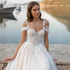 Elegant off-shoulder A-line wedding dress with floral lace embroidery and soft tulle
