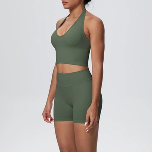 Detail of olive green seamless knit sports set with high waist shorts and halter top