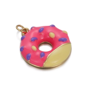 Detailed view of pink doughnut charm with gold trim and colorful zircon sprinkles
