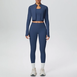 Three-piece yoga set with zip-up jacket, sports bra, and high-waist leggings in navy blue