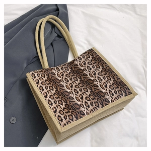 Detailed view of linen tote bag with leopard print panel and thick rope handles