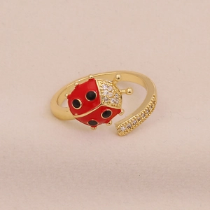 Adjustable golden ladybug ring with red enamel and sparkling zircon accents