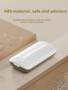 Makro-Detail des kompakten ABS-Tablettenteilers mit abgerundeten Ecken und grauem Deckel