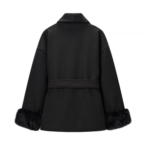 Close-up of black woolen coat back view with luxurious faux fur trim on sleeves