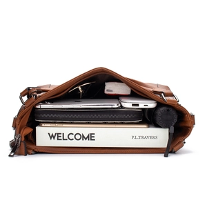Interior detail of large brown leather hobo bag showing spacious storage for daily items