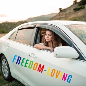 Close-up of Freedom-Loving colorful 5-inch alphabet letter stickers on a white car door