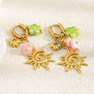 Bohemian gold plated sun tassel and flower earrings with pink stone and green petals