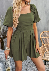 Detail view of olive green romper featuring puff sleeves and square neckline for women