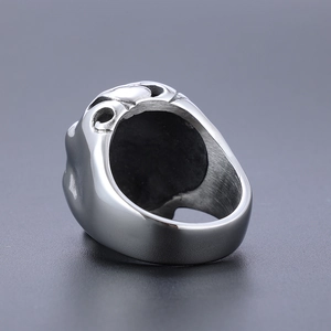 Macro shot of silver gothic skull ring showing detailed back structure and hollow metal design