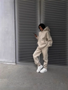 Women's minimalist beige hooded sweatshirt and matching high-waisted shorts sports set