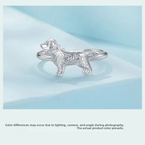 Macro shot of S925 sterling silver ring showing detailed golden retriever puppy carving