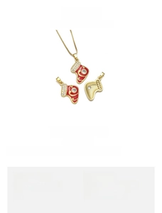 Detailed view of 18K gold plated copper Christmas sock pendant with red enamel and zircon
