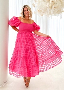 Detail of rose red checkered fabric layers on an off-shoulder summer maxi dress