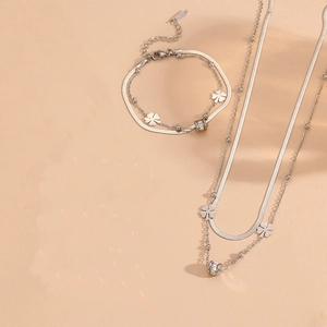 Double-layered stainless steel jewelry set with clover pendants and zircon accents
