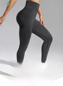 Detail of high-waisted seamless yoga pants featuring ribbed texture and push-up design