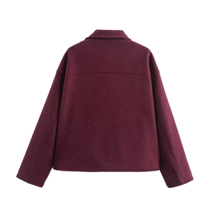 Back view of wine red wool coat showing minimalist collar and premium fabric texture