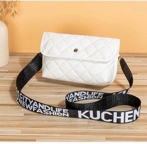 Detailed view of white quilted crossbody bag with stylish letter print wide shoulder strap