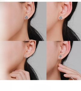Detailed view of silver stud earrings featuring turquoise stars and moon shapes