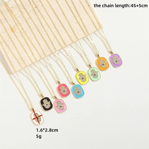 Hamsa hand necklace with colorful enamel and gold plating in multiple vibrant shades