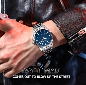 Men's business steel watch with blue dial worn by model in dynamic lighting