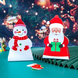 Christmas gift boxes with Santa and Snowman designs on festive green folding fan background