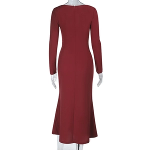 Detail view of the back of this burgundy bodycon dress showing the mermaid hemline
