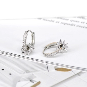 French style silver hoop earrings with rotating diamond-encrusted star pendants