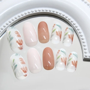 Translucent oval press-on nails with floral hand-painted designs and solid colors