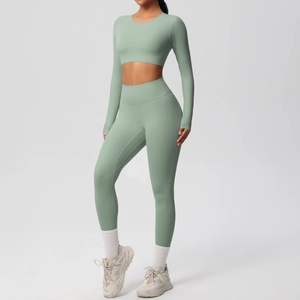 Detail view of sage green seamless high waist leggings and long sleeve crop yoga set