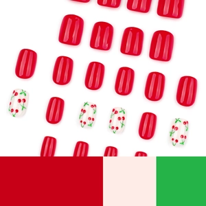 Short square press-on nails featuring glossy cherry patterns and vibrant red finish