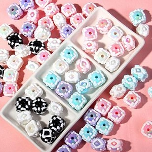 Macro view of colorful fruit painted cube beads for DIY jewelry and phone chain projects