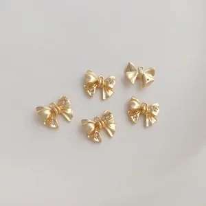 Set of five 14K gold-plated bow pendants with zircons for DIY jewelry making