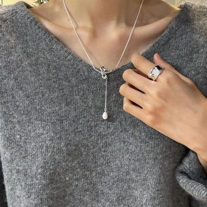 Silver bow necklace with freshwater pearl pendant and textured wide ring set