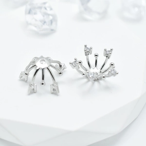 Pair of silver crown flower spacers with white zircon inlays on white platforms