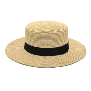 Classic beige flat top straw boater hat with black grosgrain ribbon for summer beach wear