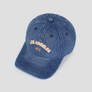 Detailed macro of Los Angeles B3 embroidery on washed denim baseball cap with visor