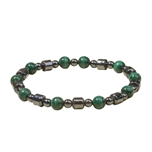 Beaded bracelet with green malachite and silver gray hematite stones on white background