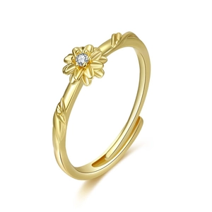Detailed view of adjustable golden daisy ring with a sparkling crystal center stone