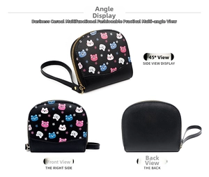 Detail of semi-circular black leather coin purse with cartoon bear prints and gold zipper
