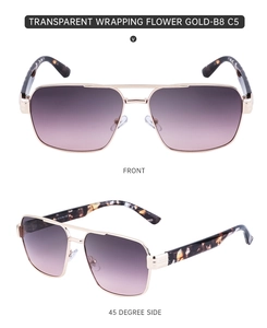 Detail of square gold sunglasses with purple gradient lenses and patterned temples