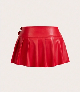 Detail view of red high-waist pleated PU leather mini skirt with decorative buckle